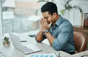 Massage Reduces Stress - Photo of a man who is stressed out.